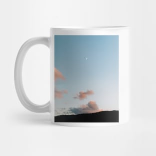 Pastel moody sunset clouds with a small moon Mug